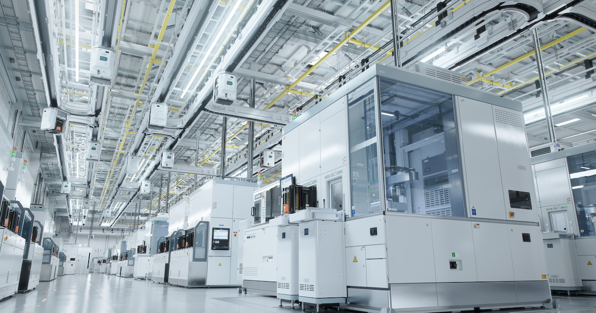 wide shot of bright semiconductor production fab cleanroom